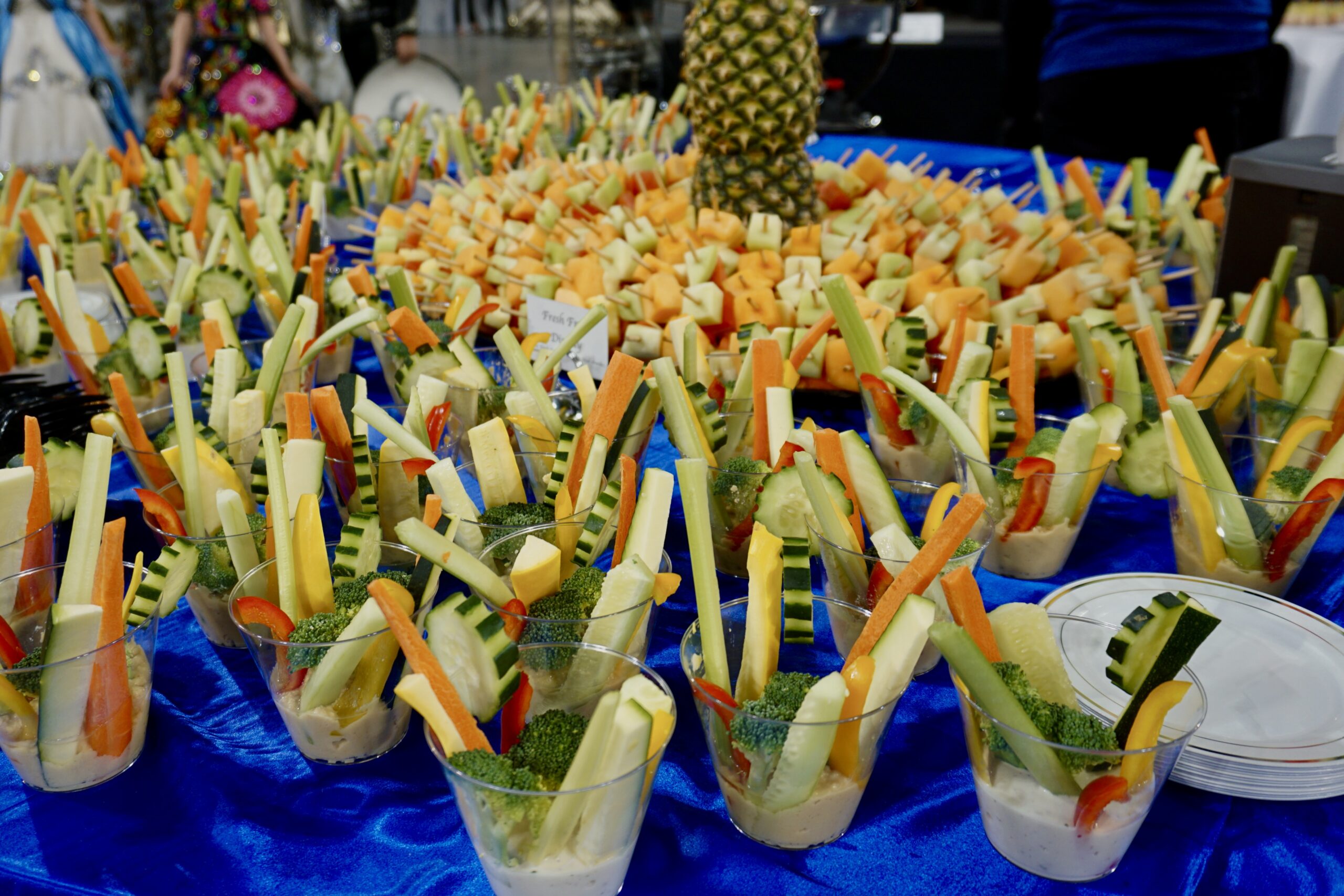 Catering food display setup with plated dishes arranged for an event by Savor Catering