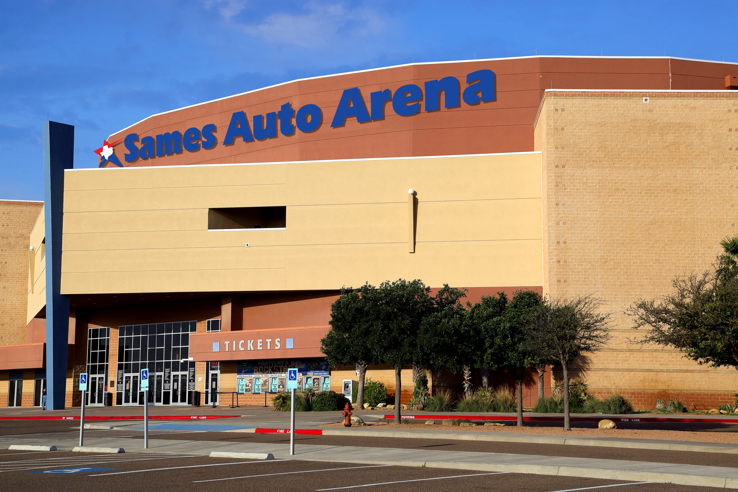 Exterior view of Sames Auto Arena stadium building in Corpus Christi with surrounding structure and signage